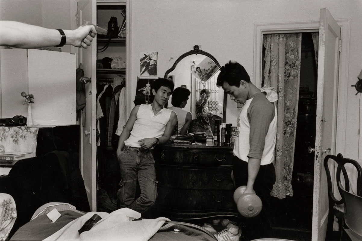 Young Cambodian men in bedroom