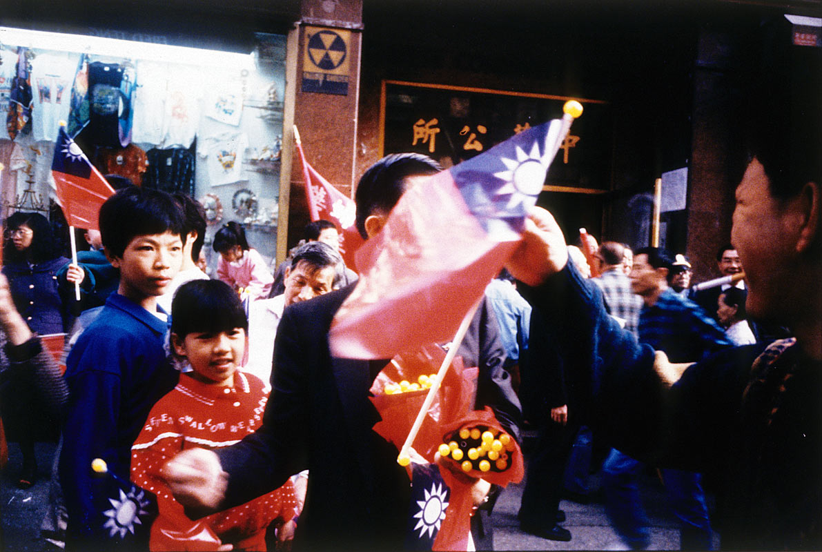 Handing Out Flags on the 80th Anniversary of the First Revolution